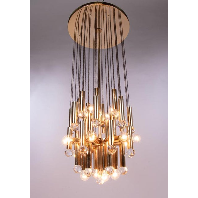 Stunning huge cascading ceiling fixture with swarovski crystal balls which hang on brass chains at varying heights....