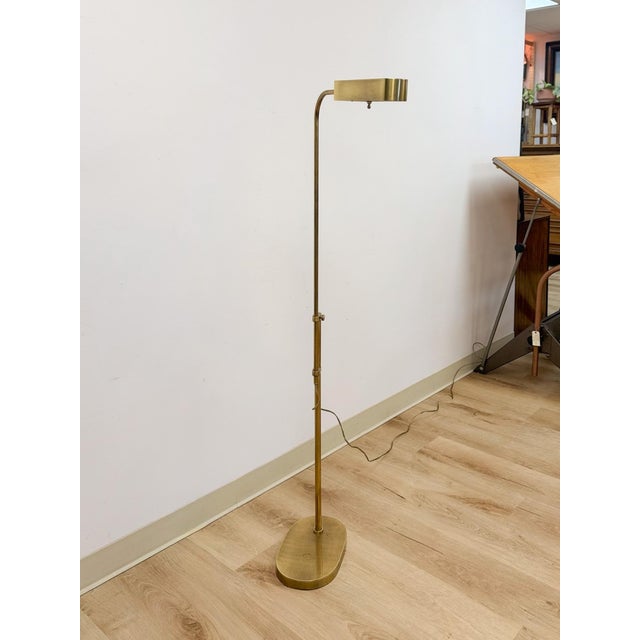 This vintage solid brass adjustable floor lamp brings warm metallic glamour and practical, directional light to any room....