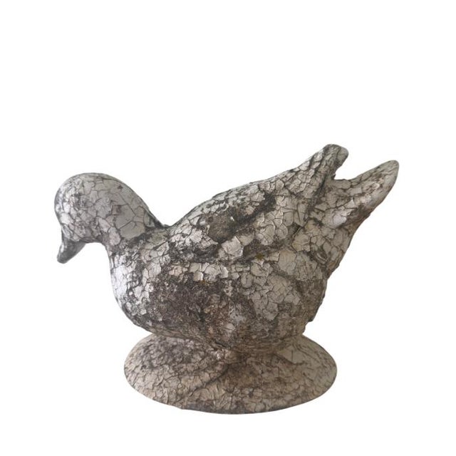 An adorable concrete garden duck, ready for spring. Don’t be afraid to use it indoors for bringing the garden in!