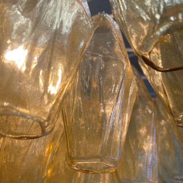 Polyhedron chandelier with a white metal frame and nearly 200 polyhedron glass pieces in amber. Six E27 light sockets,...