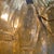 Polyhedron chandelier with a white metal frame and nearly 200 polyhedron glass pieces in amber. Six E27 light sockets,...