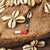 The frame of this cap is made of vegetal fibers using basketry techniques. It is intricately embroidered with cowry...