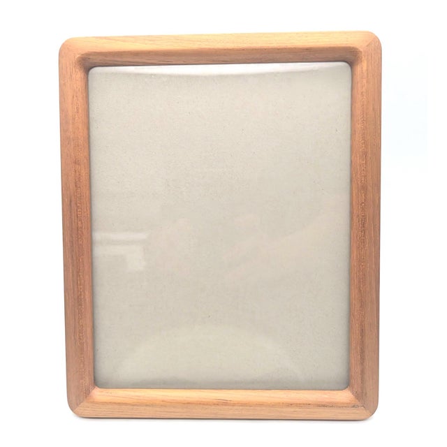 Offered is a circa. mid 1970s vintage Fetco brand Teak wood photo frame that can be propped up on its easel-back on a flat...
