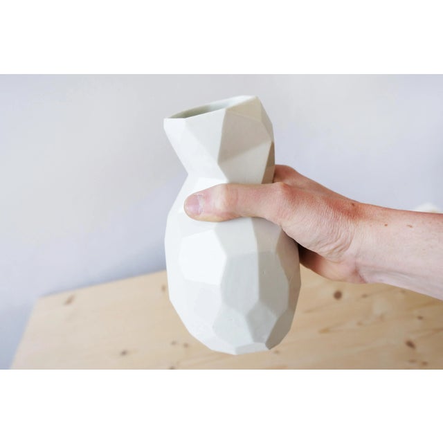 Ceramic tableware at a low resolution. Instead of smooth shapes, this pottery is build up out of polygons. It has a very...