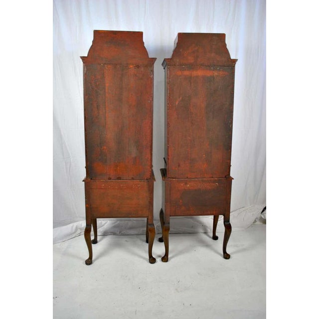 A pair of 18th century queen anne english walnut cabinets, circa 1712. Decorated with fox mirror. Walnut queen anne style...