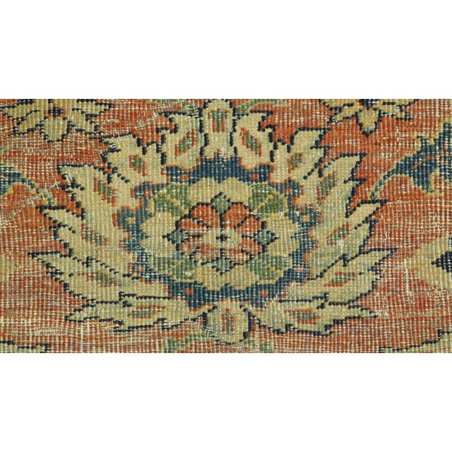 Antique Sultanabad Persian Rug. This hand knotted, distressed antique rug features palmettes on earth tone background.