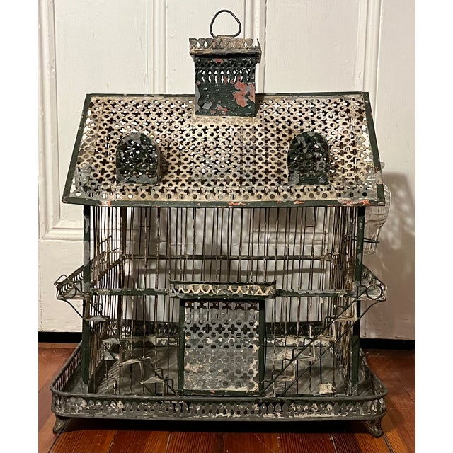 Antique 19th century French tole and wirework Victorian house form bird cage. A charming model with chimney, dormers on...