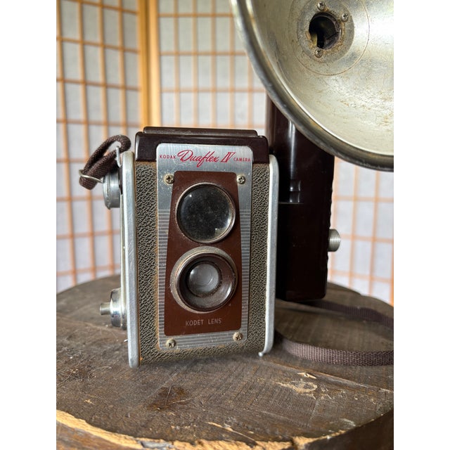 Approximate Era: 1950s Description Authentic vintage Kodak Duaflex IV camera paired with the original oversized Kodalite...
