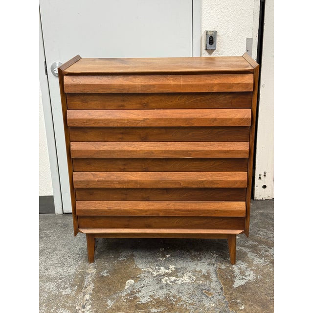 Design Plus Gallery presents the First Edition Mid-Century Tallboy Dresser from Lane Furniture. The walnut case contains...