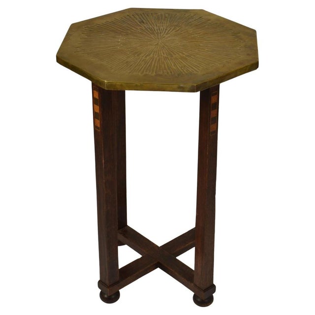 Hexagonal Modernist Amsterdam School side table with unusual relief brass top with an array texture in Dutch 1920s. This...