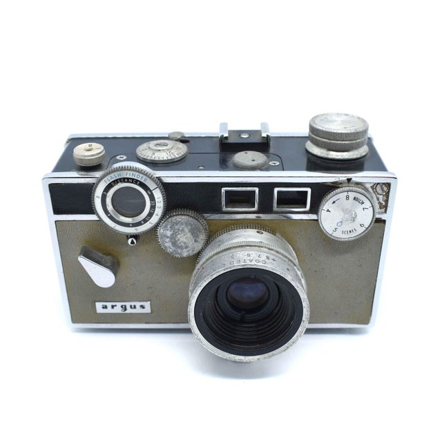 Capture a piece of photographic history with this authentic Argus C3, affectionately known by collectors as "The Brick"...