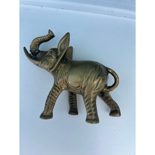Mid 20th Century figure. Brass Elephant. Can be used as paperweight on desk or has decor.