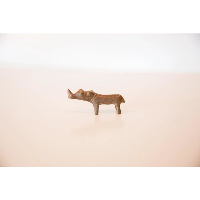 :: Vintage handmade copper casting of a miniature rhinoceros. Circa mid 20th century and possibly older, this piece has...