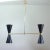 This elegant double cone chandelier was manufactured in France in the 1950s. It is made of brass and has got two black...