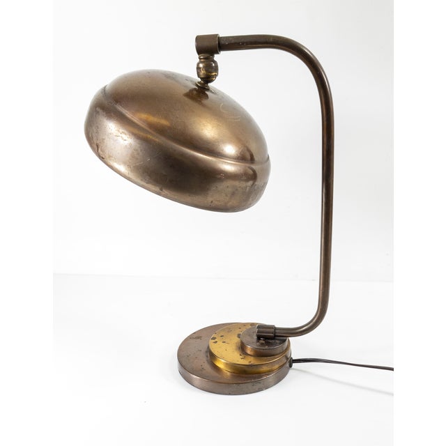 We are selling this great looking stylish Mid-Century Modern table lamp. This lamp has great copper color with some brass...