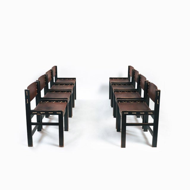 Beautiful and rare set of 8 hideleather brutalist chairs. 2 sets available. This piece is designed in the style of the...