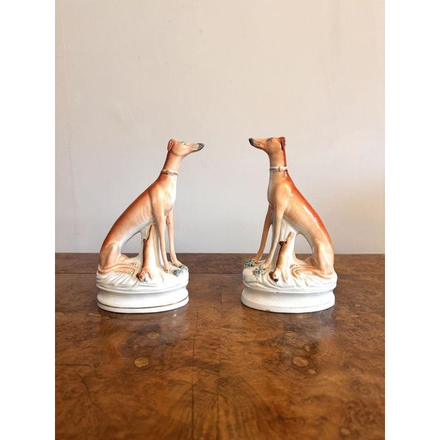 Quality pair of antique Victorian Staffordshire greyhounds, having a quality pair of antique Victorian Staffordshire...