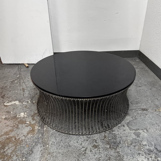 Design Plus Gallery presents an Industrial Style Coffee Table from Interlude Home. The table has a sturdy metal base with...