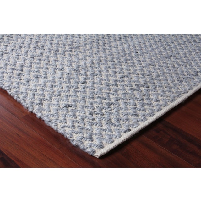Subtle simplicity was key in creating the sleek and classic design of the Witten rug. Beautifully handwoven with a unique...