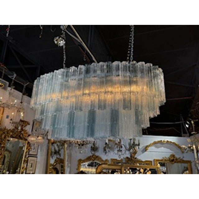 Beautiful large scale layered Murano glassTronchi style chandelier. In the colors of fontana green and white. Sure to make...