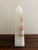 A beautifully proportioned onyx marble obelisk in richly veined shades of green, cream, and brown. The sculptural...
