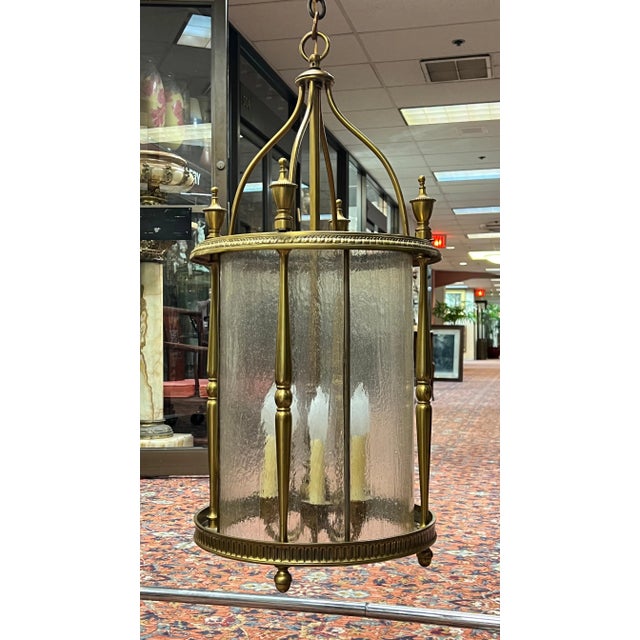 Vintage, large brass chandelier in the English Georgian Regency (or American Federal) style measuring 15 inches across and...