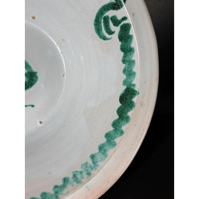 A charming traditional Spanish lebrillo bowl, hand-painted in the distinctive Fajalauza style of Granada. The piece...