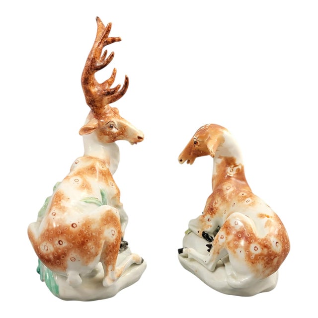 A rare pair of derby porcelain animal figures representing a recumbent stag and doe, circa 1765–1770. Executed in soft-...
