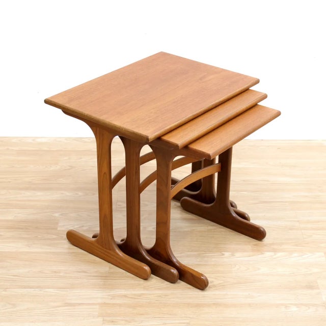 Mid-century set of nesting tables by G Plan. Constructed from teak and afromosia, these quality side tables are...