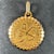 An 18 karat (18K) yellow gold charm pendant designed as the Zodiac sign of Libra, depicting a pair of scales with the...