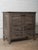 This antique wooden drawer chest from India showcases the warmth, character, and craftsmanship of early 20th-century...