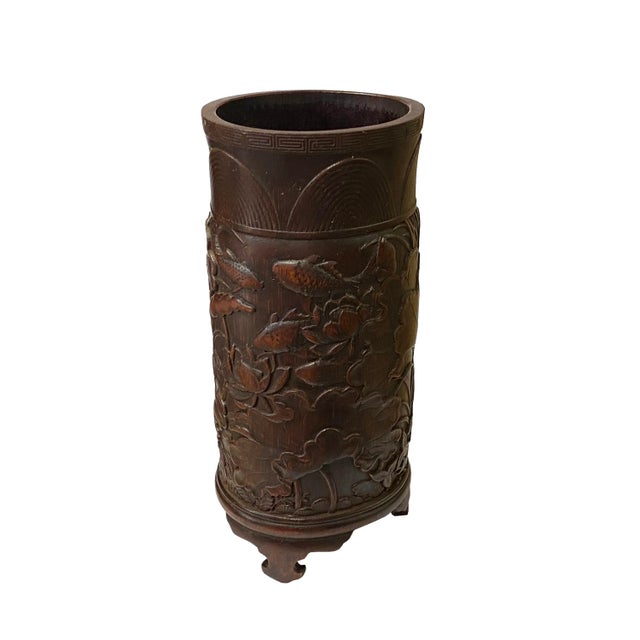 This is a Chinese bamboo brush pen holder with lotus leaves and fishes motif. It has its own wood patina and color. Good...