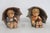 This adorable Figurine Pair is made of porcelain finished ceramic. This charming Hummel pair are titled "Girl with...