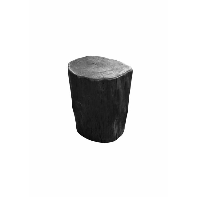 A sculptural side table hand-crafted from solid lychee wood by skilled artisans on the island of Bali. The piece is...