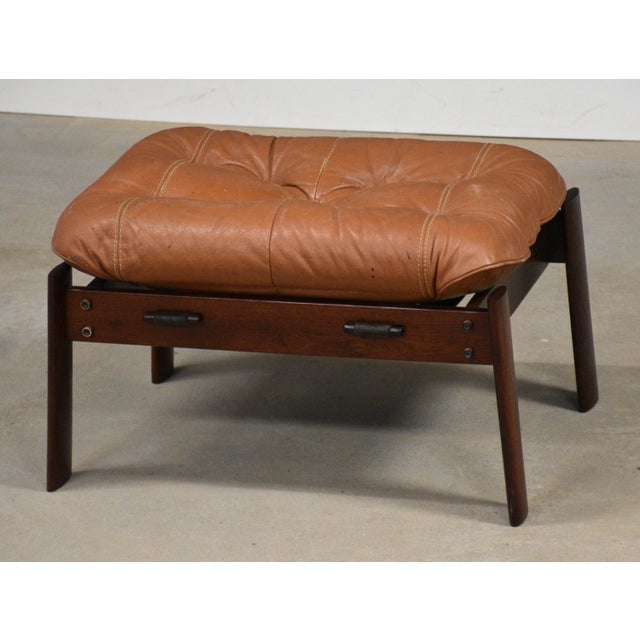 A mid century modern jacaranda rosewood and leather ottoman designed by Percival Lafer. Made in Brazil. Circa 1960’s....