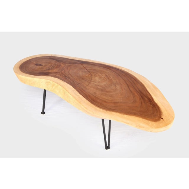 This one slab living edge coffee table is hand cut, sanded, and polished to show beautiful waving circular wood grains and...