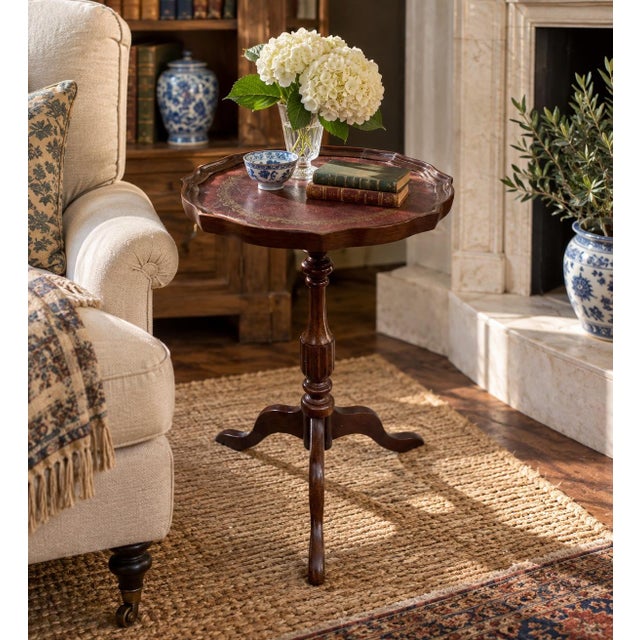 A handsome Georgian-style drinks table crafted in rich mahogany and finished with a beautifully embossed burgundy leather...