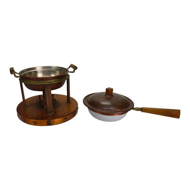 This antique Arts & Crafts chafing dish, dating to approximately 1920, features a copper pan and lid with a robust oak...
