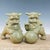 This charming pair of antique celadon glazed guardian lions brings a serene, historical presence to any interior. Each...