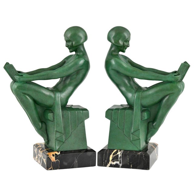 Art Deco bookends reading nudes, Delassement, by Max Le Verrier. Patinated Art Metal on a green marble base. France, circa...