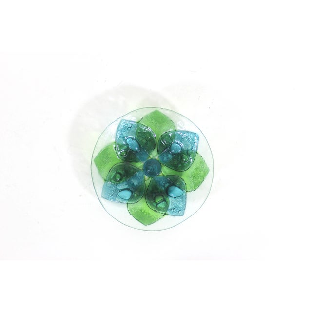 Width: 6.25 inches Height: 1.25 inches Mid century art glass bowl with overlapping blue and green petals and lots of...