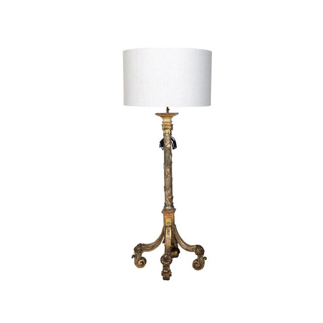 Baroque Revival grand giltwood torchère floor lamp. Elaborately carved central column adorned with foliate motifs. Tripod...