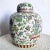 A stunning example of traditional Chinese artistry, this hand-painted porcelain ginger jar features a vibrant palette of...
