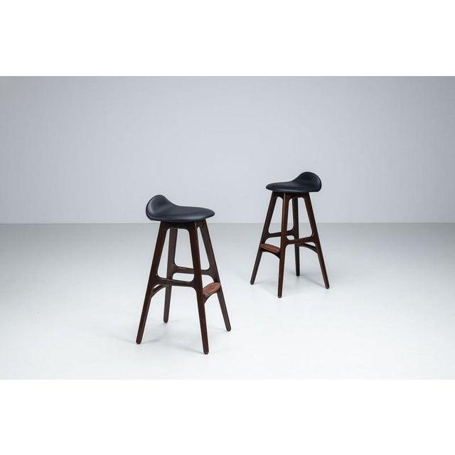 Pair of bar stools designed by Erik Buch for Oddense Møbler, Denmark, circa 1965. These elegant Scandinavian modern stools...
