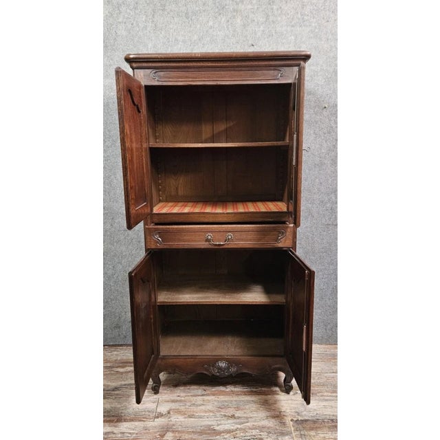 Beautiful rustic oak armoire, with authentic charm and elegant lines. It features two doors in the upper section, a...