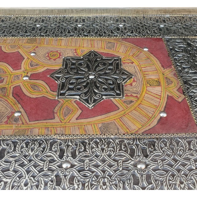 Very exotic all metal inlaid Moroccan console table. Stained leather throughout for a better look. With its detailed...