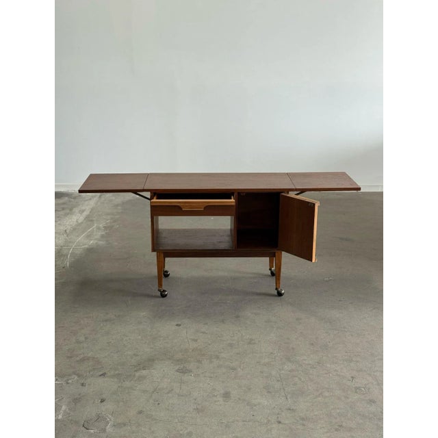 W37.5 W69.5 extended D18 H30 Fully refinished walnut bar cart with new wheels. This piece is fully functional with a...