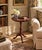 A handsome Georgian-style drinks table crafted in rich mahogany and finished with a beautifully embossed burgundy leather...