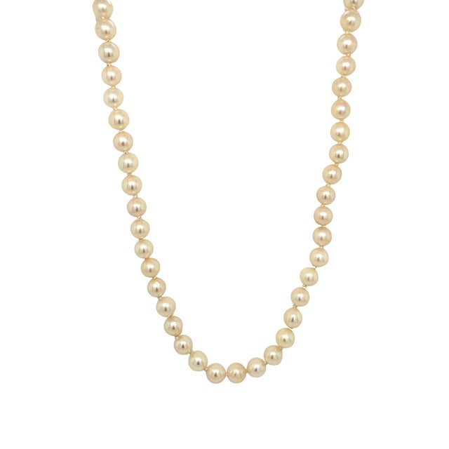 A long 32 inch strand of cultured pearls in creamy ivory with soft rosy overtones and a lovely luster. The pearls are...