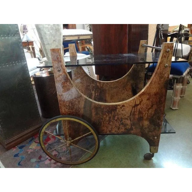 Stunning Italian midcentury lacquered goatskin bar cart, serving cart or drink cart with brass fittings by Aldo Tura....
